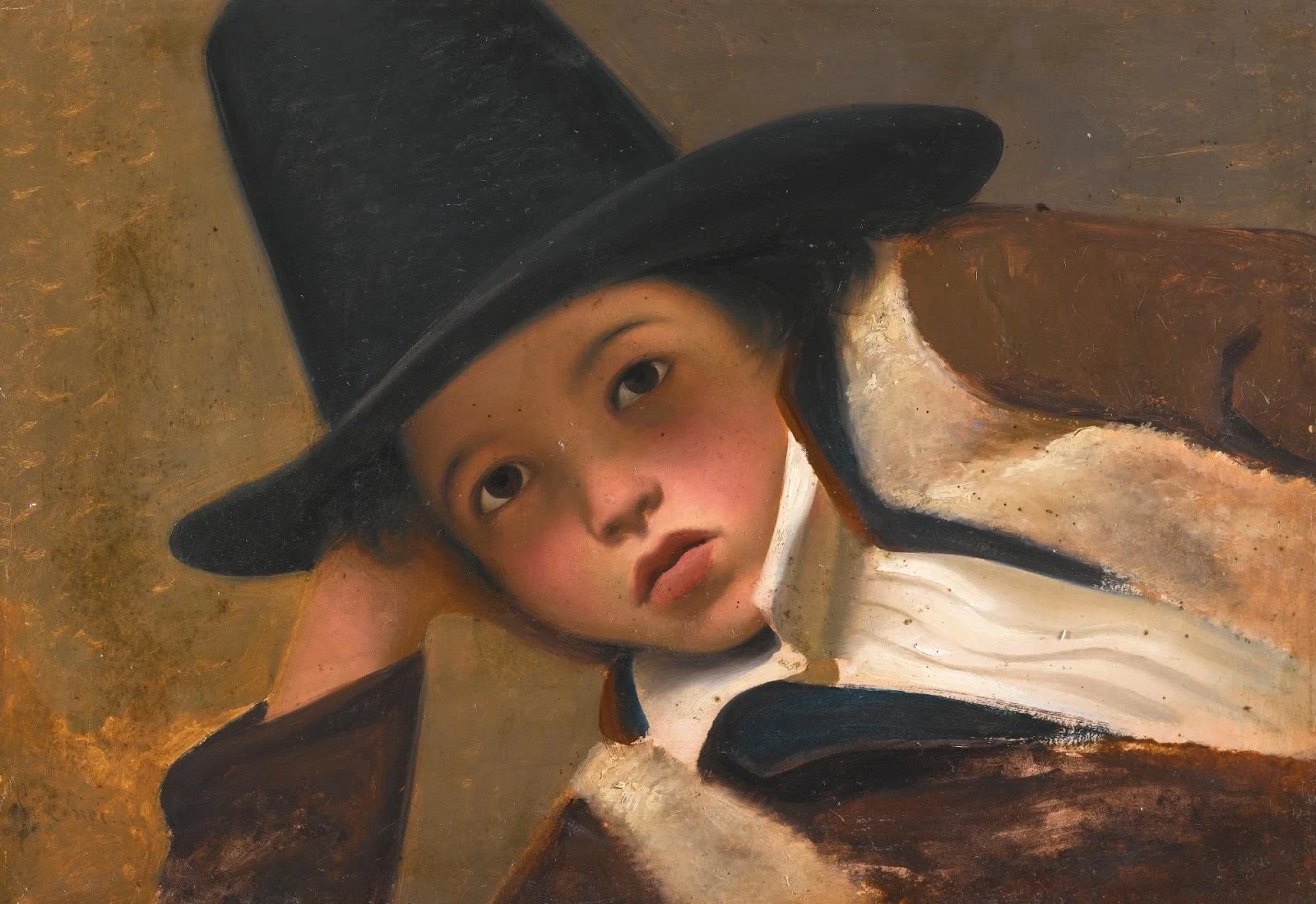 Ritratto di un bambino con cappello nero in testa